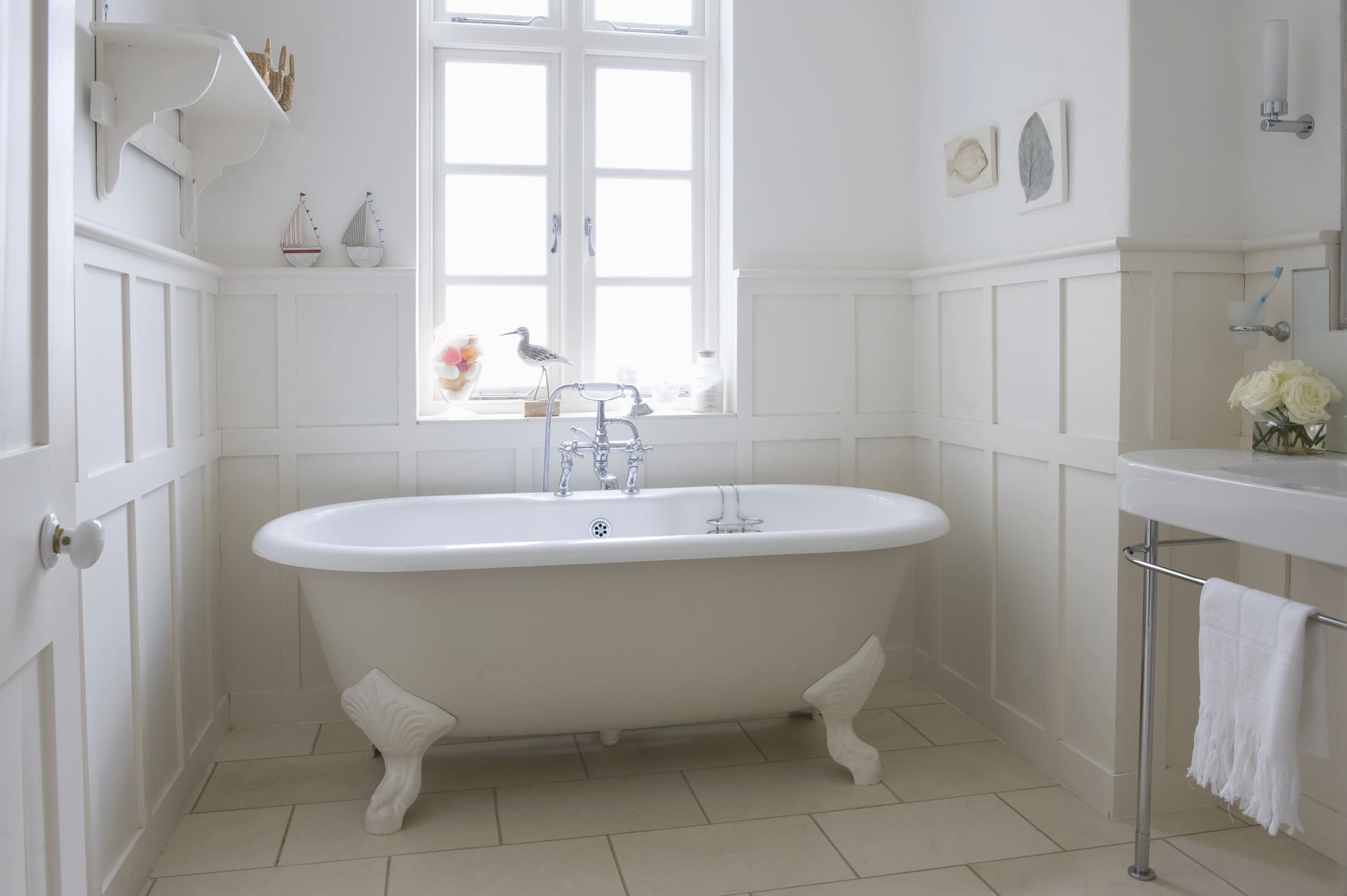 Elegant bathroom serviced by emergency plumber San Francisco specialists featuring clawfoot tub.