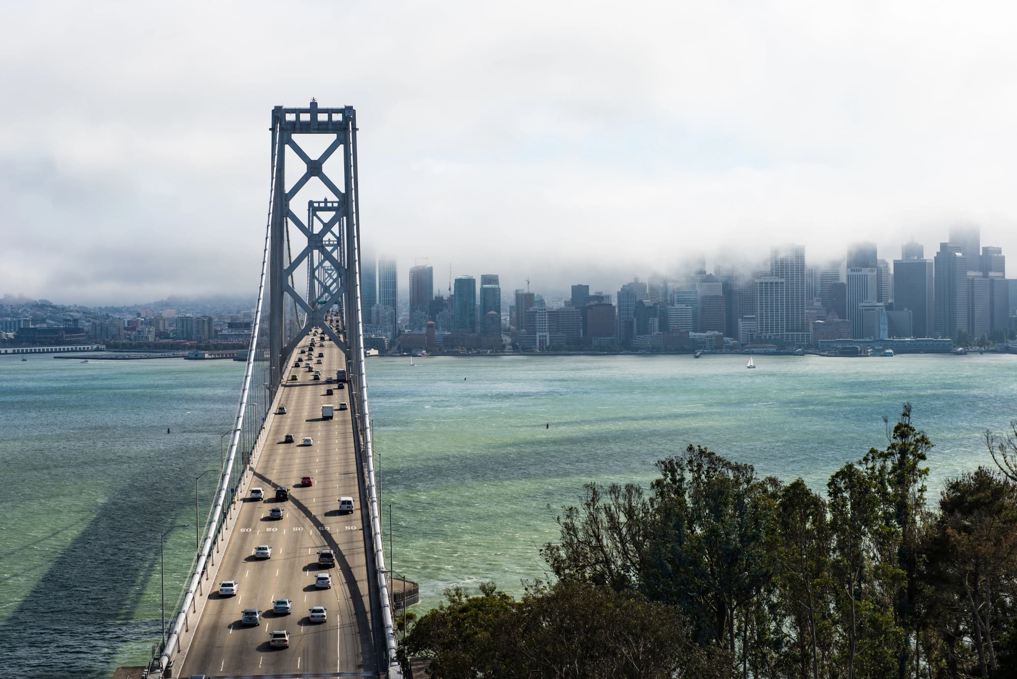 Hydrojetting San Francisco services covering the entire Bay Area - iconic bridge with foggy skyline
